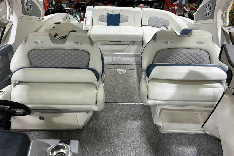 Slide: The Image of 2012 Chaparral 327 SSX boat interior with luxurious white seating and modern design. - 29