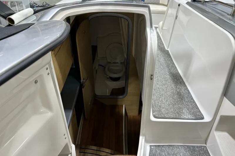 Slide: The Image of 2012 Chaparral 327 SSX boat interior with cabin and toilet view. - 30