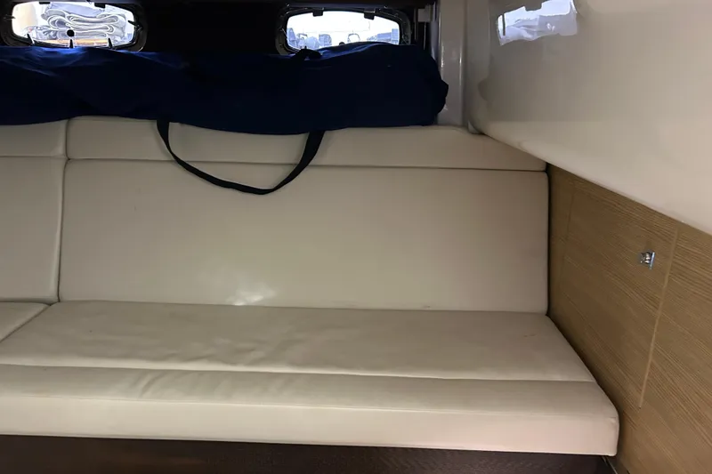 Slide: The Image of Interior cabin of 2012 Chaparral 327 SSX boat with beige seating. - 38