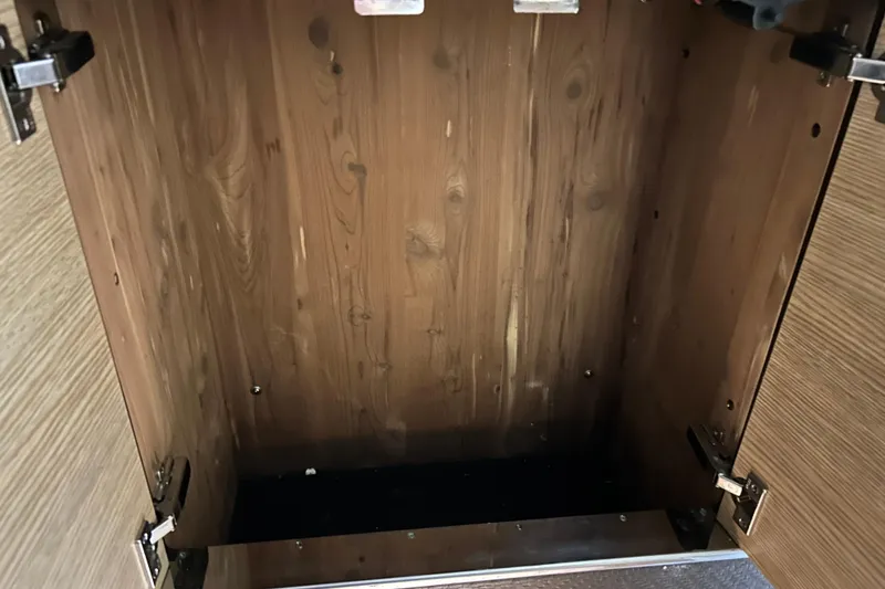 Slide: The Image of Empty wooden cabinet interior on a 2012 Chaparral 327 SSX boat. - 45