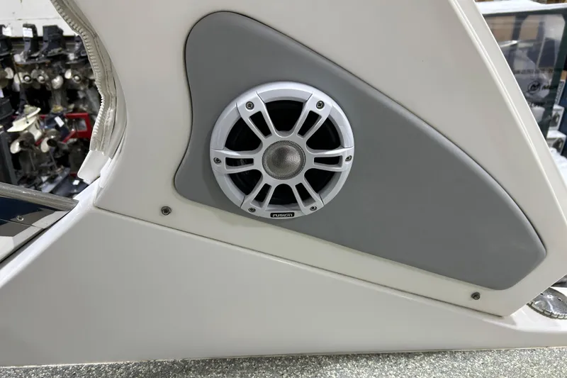 Slide: The Image of 2012 Chaparral 327 SSX boat speaker detail, featuring a Fusion marine audio system. - 47