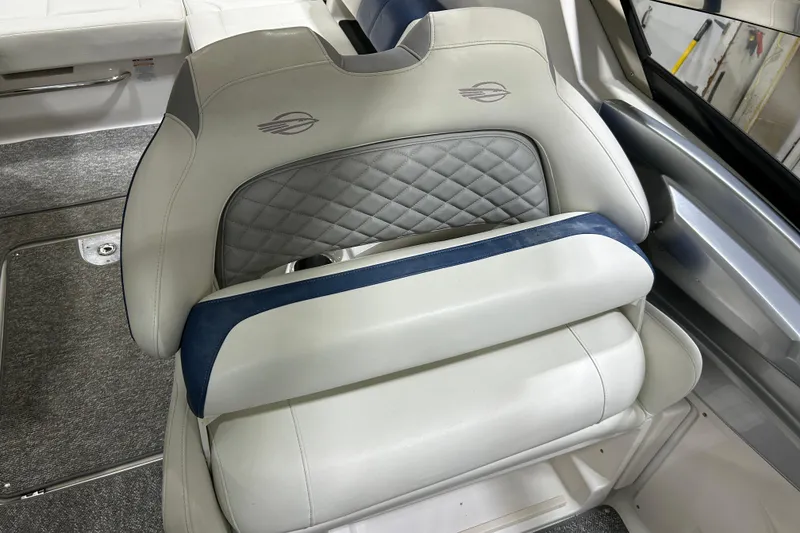 Slide: The Image of Luxury seating in 2012 Chaparral 327 SSX boat, featuring quilted upholstery and sleek design. - 58