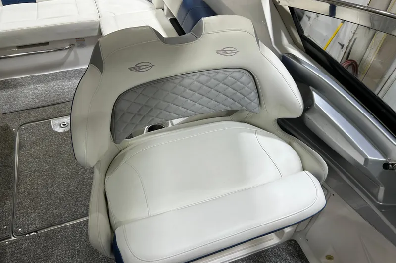 Slide: The Image of 2012 Chaparral 327 SSX boat interior with luxurious white seating and quilted design. - 59