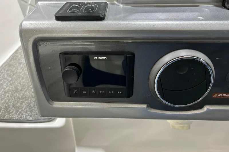 Slide: The Image of Control panel of 2012 Chaparral 327 SSX boat with Fusion audio system. - 62