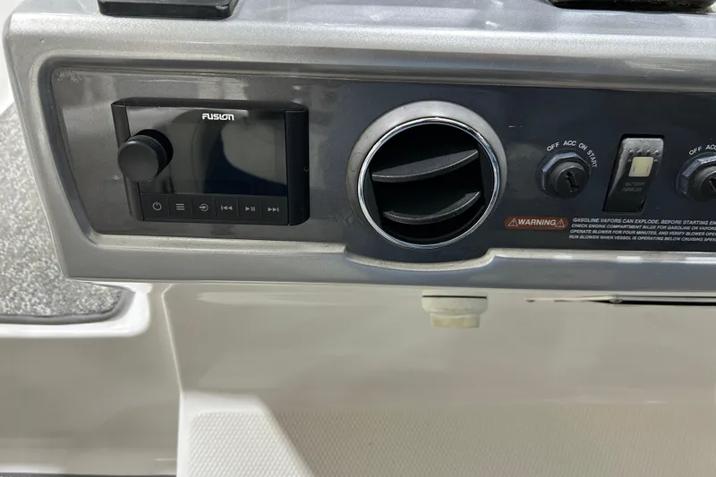 Slide: The Image of Control panel of a 2012 Chaparral 327 SSX boat with Fusion audio system. - 63