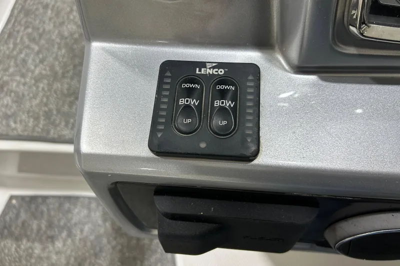 Slide: The Image of Lenco trim tab control on 2012 Chaparral 327 SSX boat dashboard. - 64