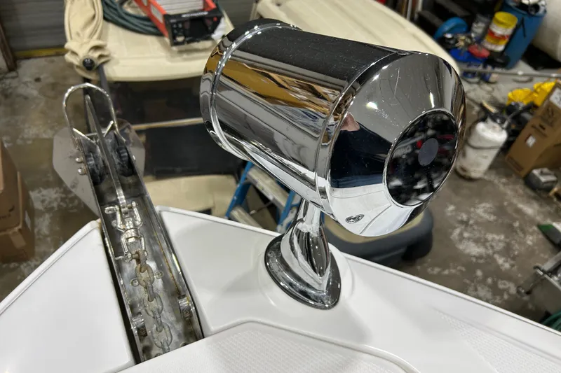 Slide: The Image of Chrome spotlight on 2012 Chaparral 327 SSX boat, with anchor chain visible. - 65