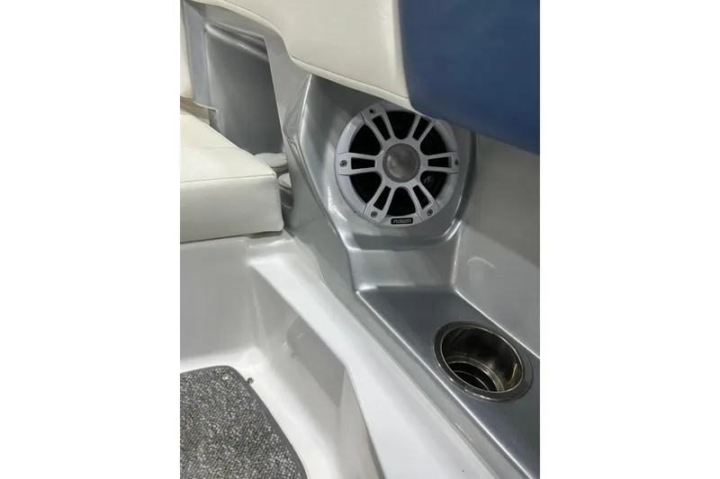 Slide: The Image of 2012 Chaparral 327 SSX boat interior with speaker and cup holder. - 66