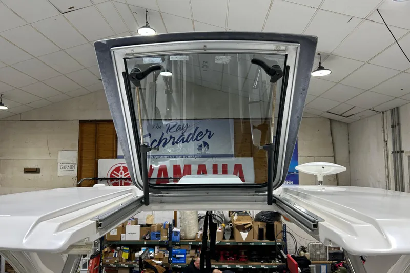 Slide: The Image of 2012 Chaparral 327 SSX boat windshield in a workshop setting. - 67