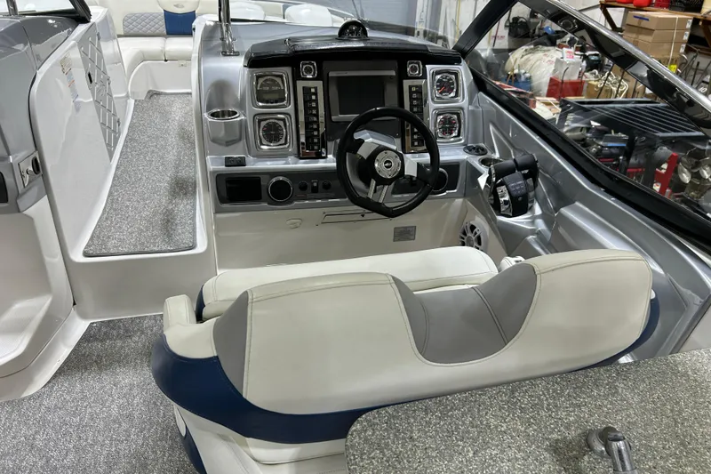 Slide: The Image of Interior of 2012 Chaparral 327 SSX boat with modern dashboard and steering wheel. - 68