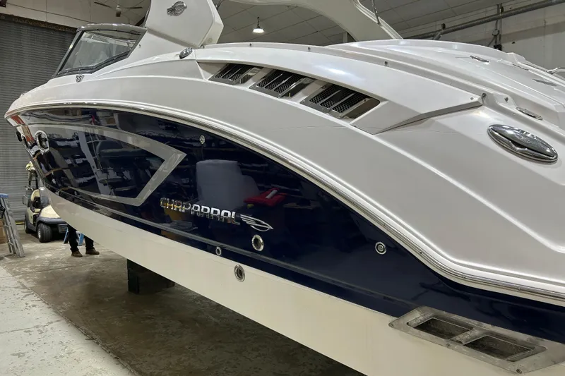 Slide: The Image of Chaparral 327 SSX 2012 boat in a garage, showcasing sleek design and detailing. - 74