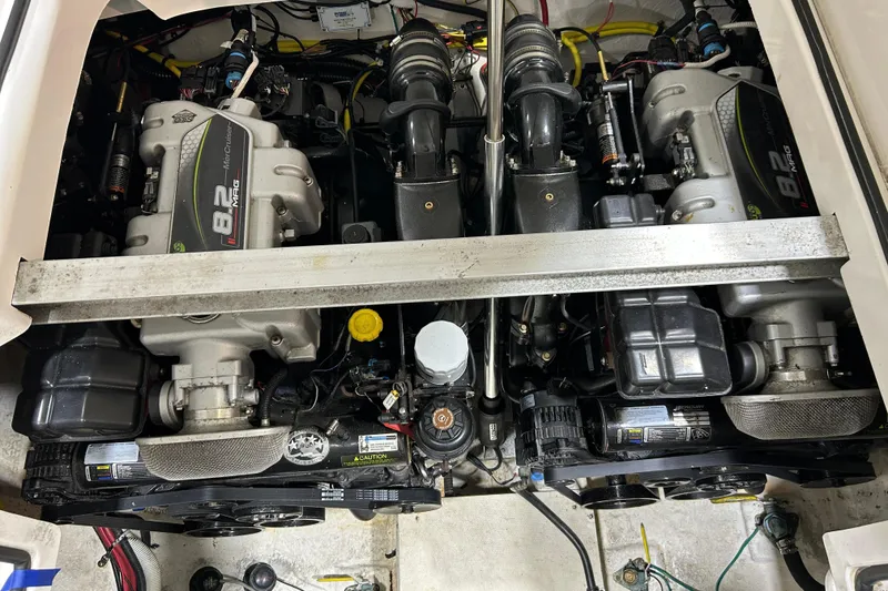 Slide: The Image of Engine compartment of a 2012 Chaparral 327 SSX boat, featuring dual 8.2 MAG engines. - 98
