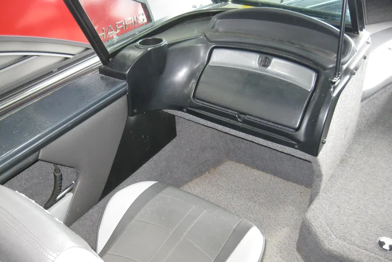 Slide: The Image of Interior of 2021 Lund 1875 Crossover XS boat, featuring seating and storage compartments. - 11