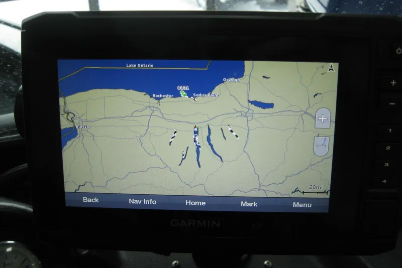 Slide: The Image of Garmin GPS displaying map of Lake Ontario region on 2021 Lund 1875 Crossover XS boat. - 14