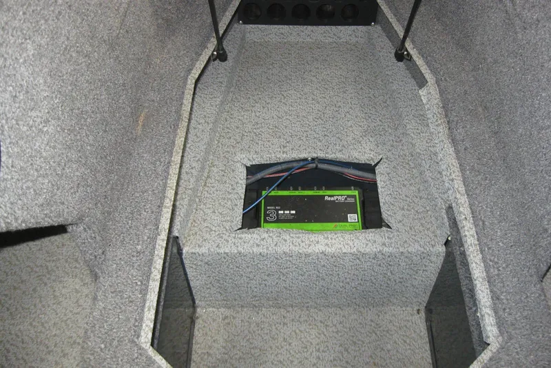 Slide: The Image of 2021 Lund 1875 Crossover XS interior with RealPRO battery charger installed. - 16