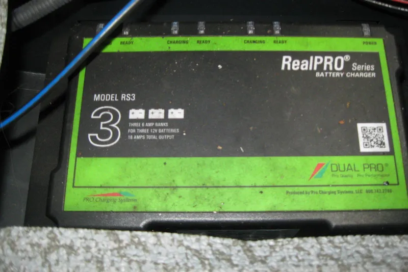 Slide: The Image of Battery charger RealPRO Series Model RS3 in a 2021 Lund 1875 Crossover XS boat. - 17