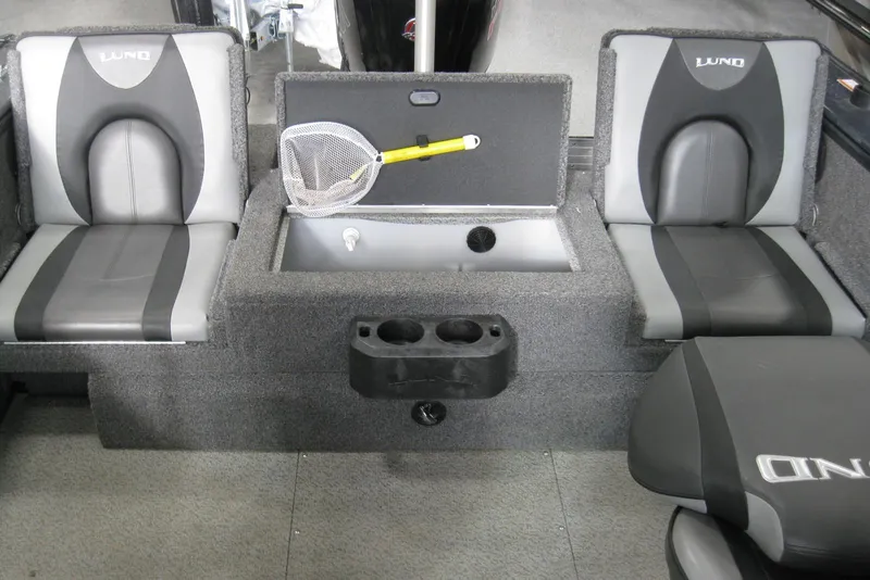 Slide: The Image of 2021 Lund 1875 Crossover XS boat interior with seating and storage compartments. - 8