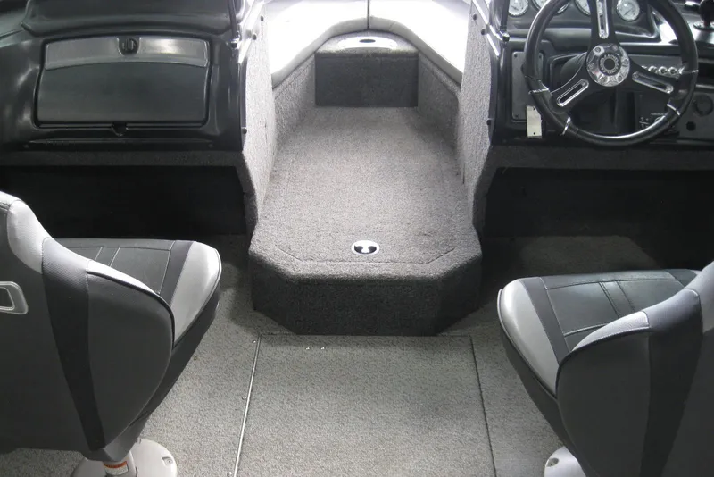 Slide: The Image of 2021 Lund 1875 Crossover XS interior with dual seats and steering wheel. - 9