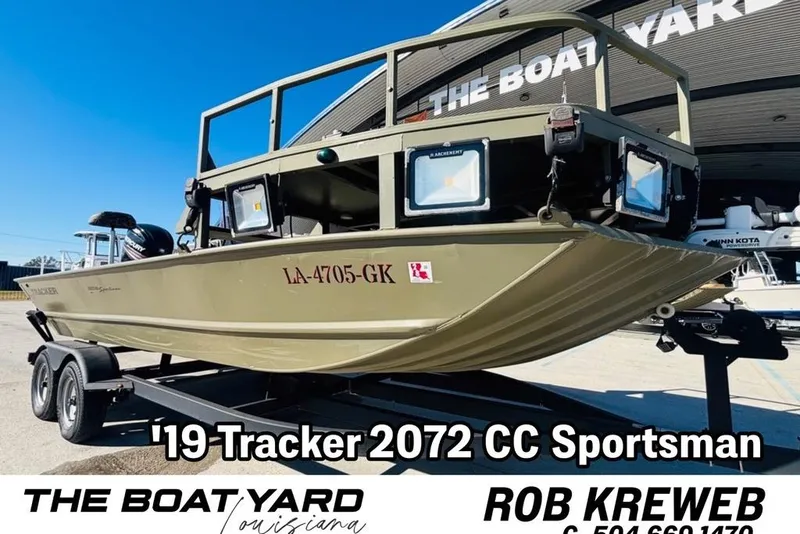 The Image of 2017 Tracker Grizzly 2072 MVX CC Sportsman boat on trailer at dealership. - 1