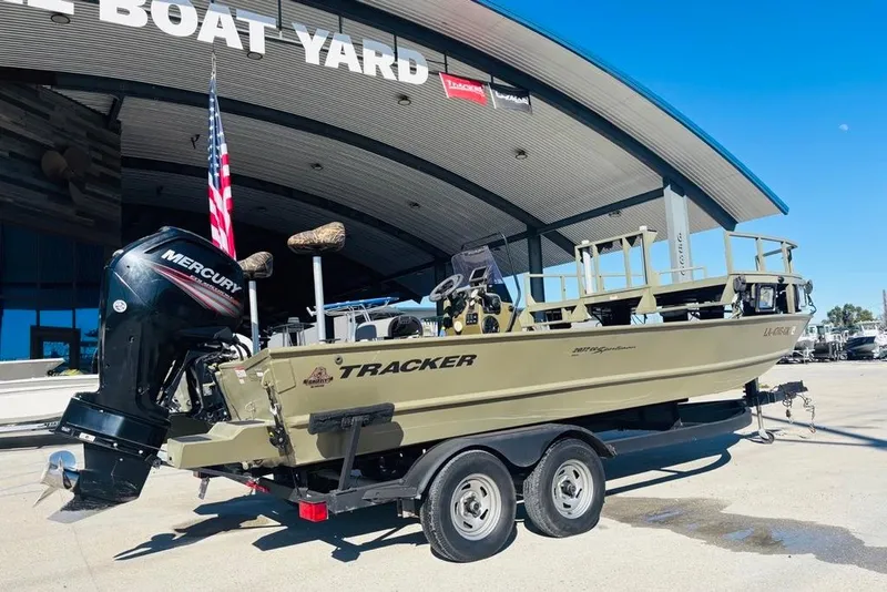 Slide: The Image of 2017 Tracker Grizzly 2072 MVX CC Sportsman boat on trailer at dealership. - 3