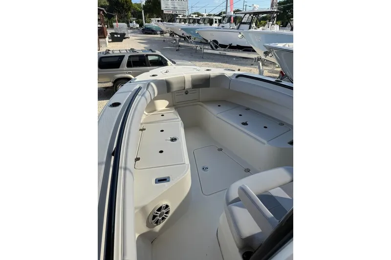 Slide: The Image of 2021 Mako 234 Center Console boat interior with seating and storage compartments. - 5