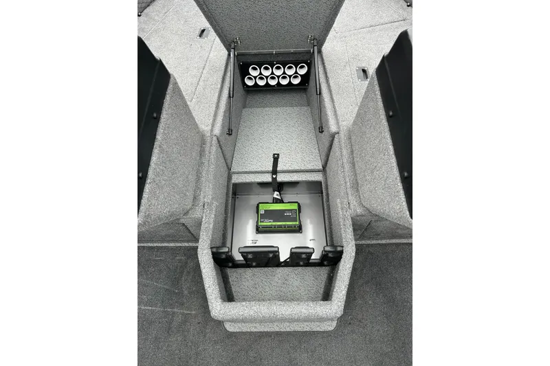 Slide: The Image of 2018 Lund 1775 Impact Sport boat interior with storage compartment and battery. - 21