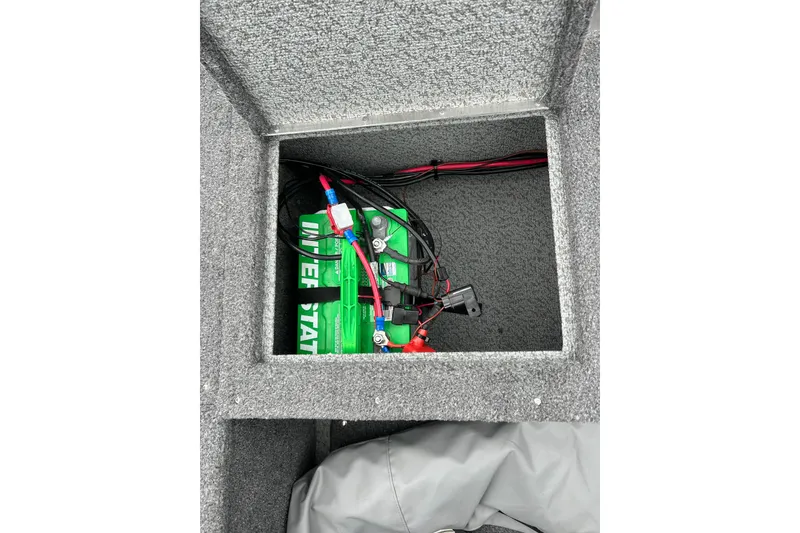 Slide: The Image of Battery compartment of 2018 Lund 1775 Impact Sport boat with wiring connections. - 23