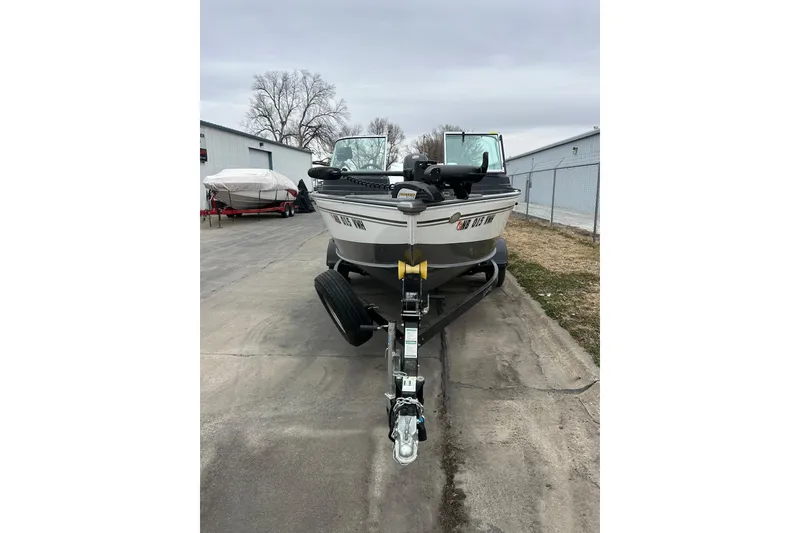 Slide: The Image of 2018 Lund 1775 Impact Sport boat on trailer, parked outdoors. - 3