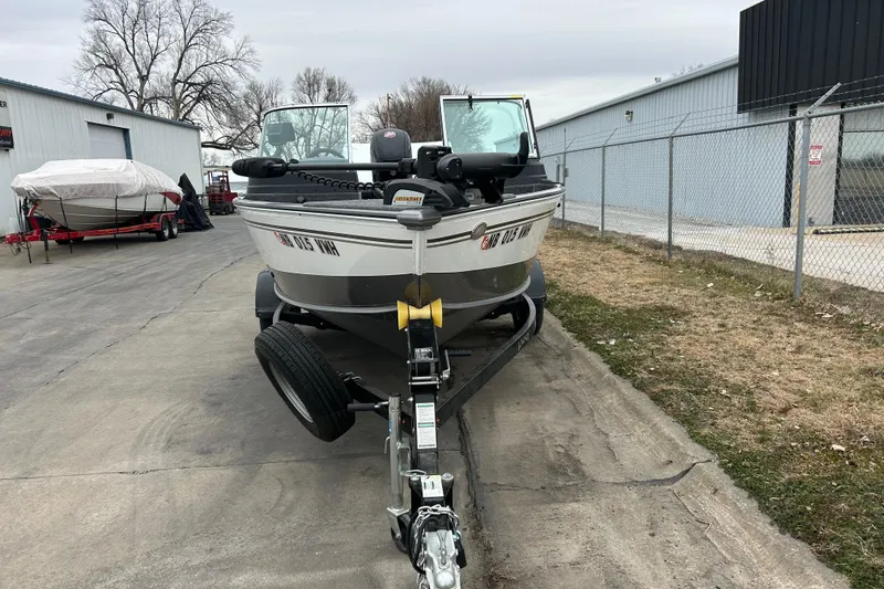 Slide: The Image of 2018 Lund 1775 Impact Sport boat on trailer in outdoor storage area. - 4