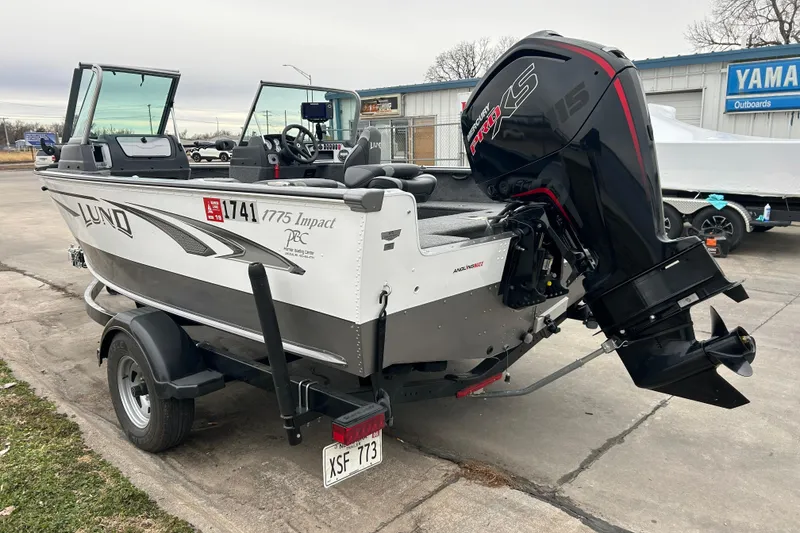 Slide: The Image of 2018 Lund 1775 Impact Sport boat with powerful outboard motor on trailer. - 6