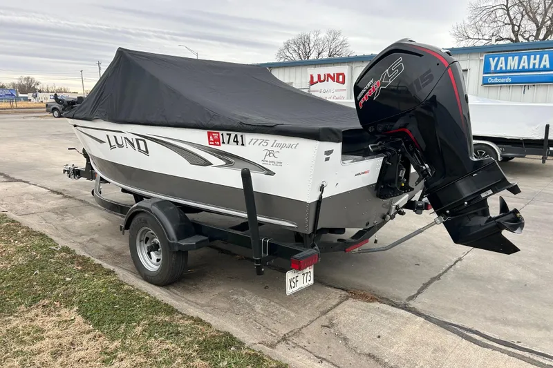 Slide: The Image of 2018 Lund 1775 Impact Sport boat with cover and outboard motor on trailer. - 9