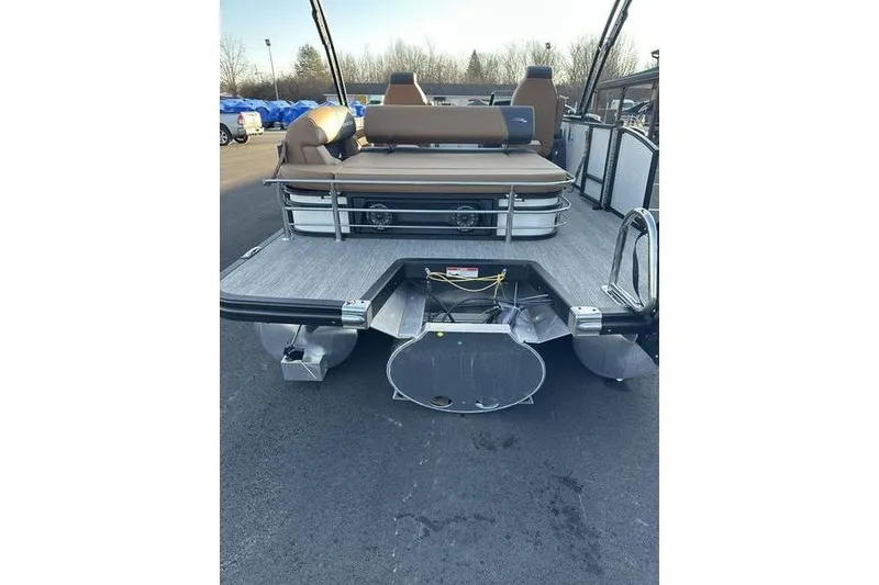 Slide: The Image of 2026 Bennington S Swingback 23 SSB ESP pontoon boat, rear view, docked outdoors. - 11