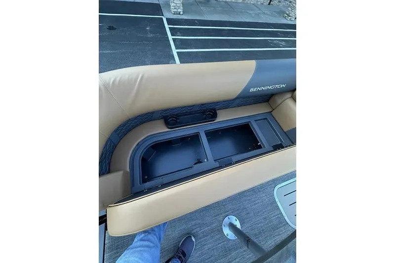 Slide: The Image of 2026 Bennington S Swingback 23 SSB ESP boat seat storage compartment open. - 13
