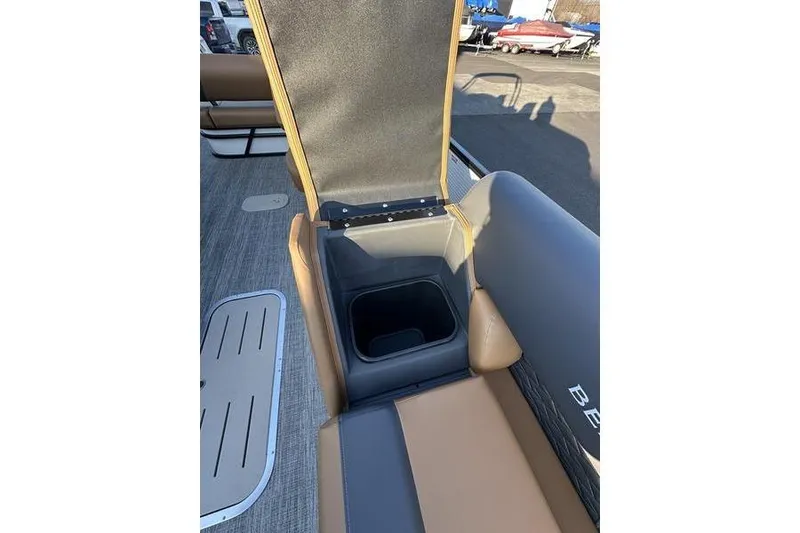 Slide: The Image of 2026 Bennington S Swingback 23 SSB ESP boat seat with open storage compartment. - 14