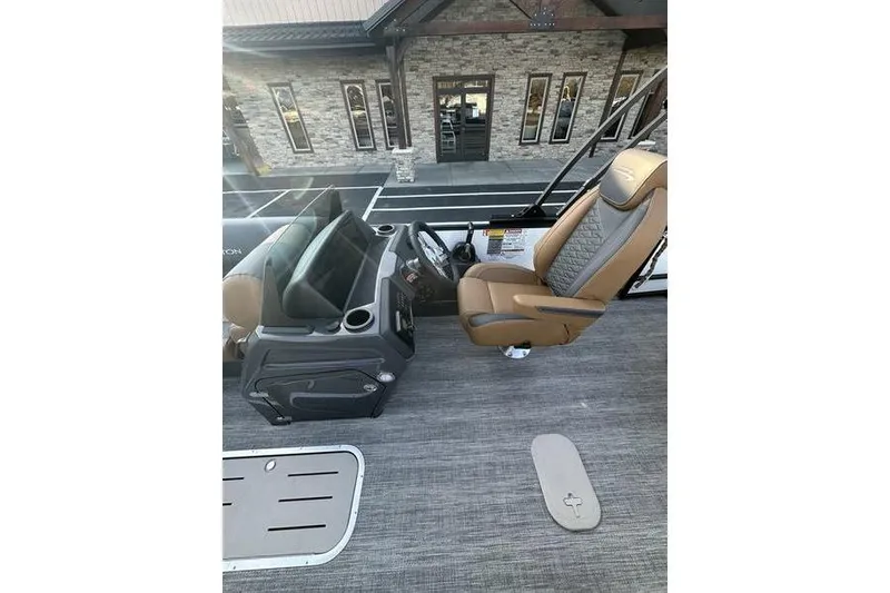 Slide: The Image of 2026 Bennington S Swingback 23 SSB ESP boat interior with captain's chair and console. - 15