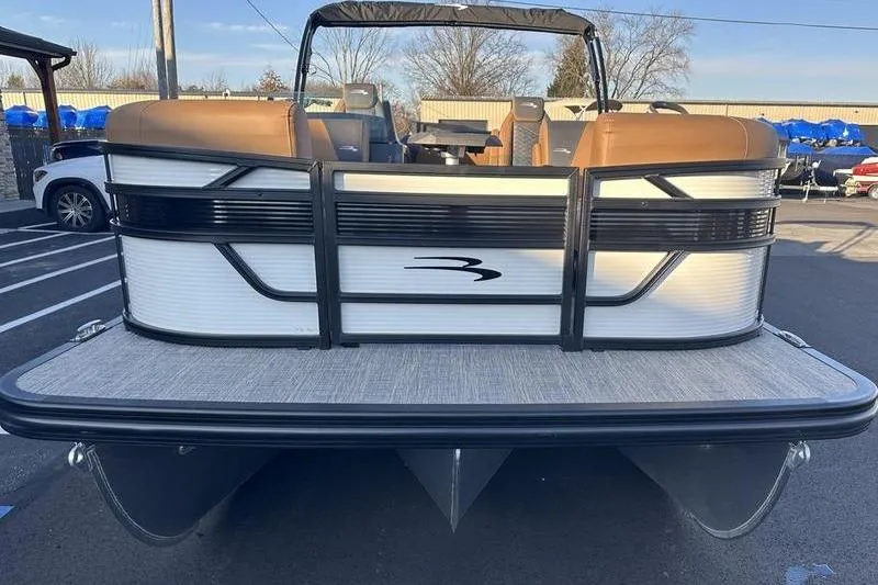 Slide: The Image of 2026 Bennington S Swingback 23 SSB ESP pontoon boat, rear view in a parking lot. - 5