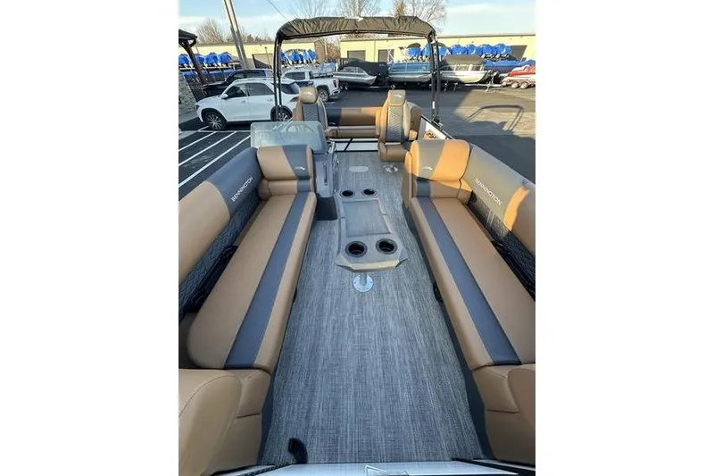 Slide: The Image of 2026 Bennington S Swingback 23 SSB ESP pontoon boat interior with tan and gray seating. - 6