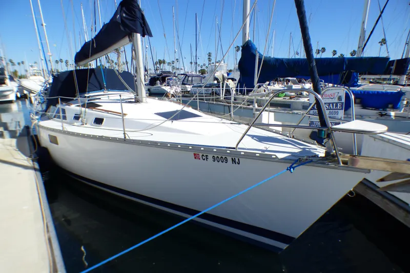 The Image of 1994 Hunter Legend 35.5 sailboat docked, for sale sign visible. - 0