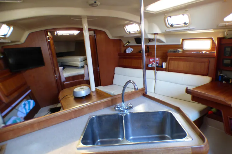 Slide: The Image of Interior of 1994 Hunter Legend 35.5 sailboat with cozy seating and kitchen area. - 12
