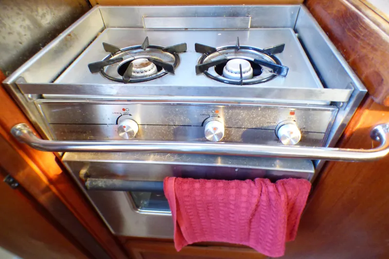 Slide: The Image of Stove in 1994 Hunter Legend 35.5 yacht kitchen with red towel. - 14