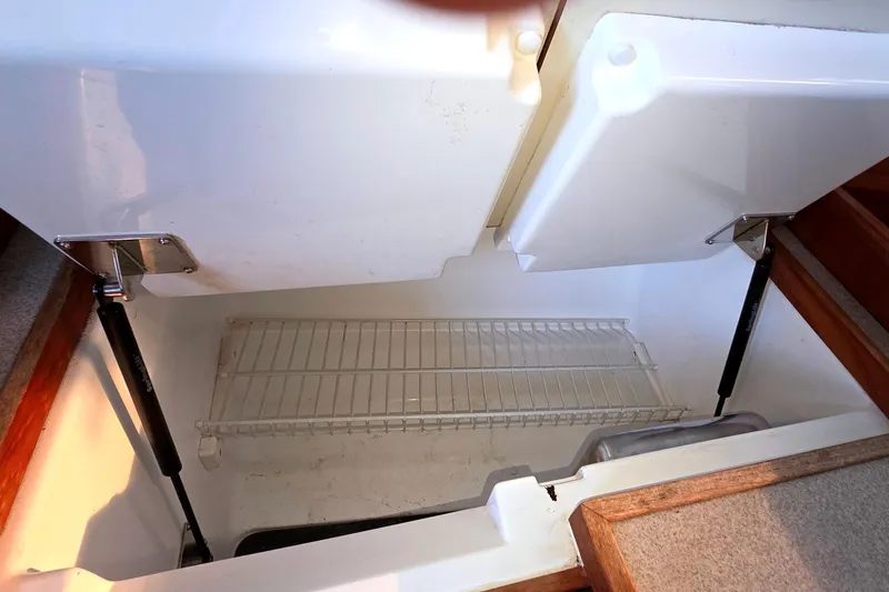 Slide: The Image of Interior view of a 1994 Hunter Legend 35.5 yacht refrigerator compartment. - 15