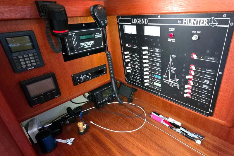 Slide: The Image of Control panel of a 1994 Hunter Legend 35.5 sailboat with navigation and communication equipment. - 16