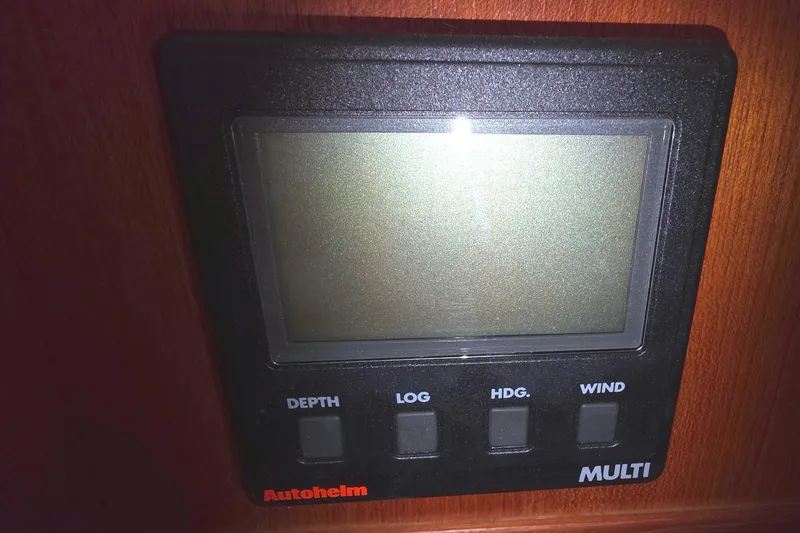 Slide: The Image of Autopilot display panel on 1994 Hunter Legend 35.5 sailboat, featuring depth, log, heading, wind. - 20