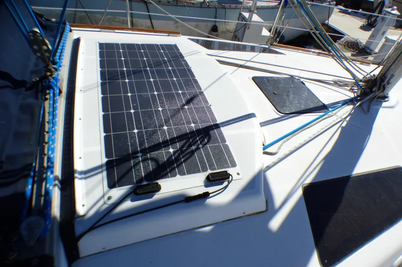 Slide: The Image of Solar panel on 1994 Hunter Legend 35.5 sailboat deck, harnessing renewable energy. - 27