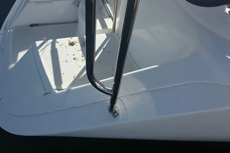 Slide: The Image of Close-up of 1994 Hunter Legend 35.5 yacht deck with railing and scattered debris. - 28
