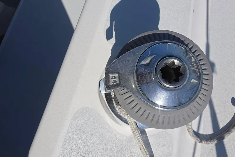 Slide: The Image of Winch on 1994 Hunter Legend 35.5 sailboat deck, sunlight reflecting on metal. - 30