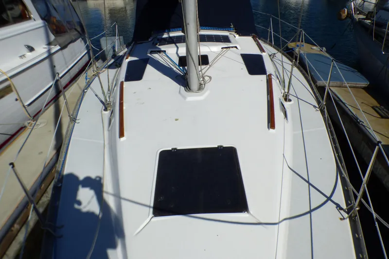 Slide: The Image of 1994 Hunter Legend 35.5 sailboat deck view, docked at marina. - 5