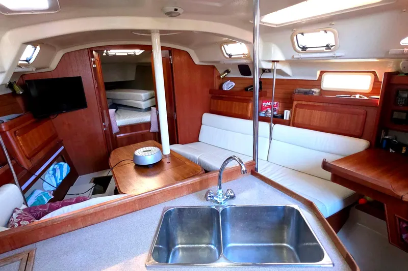 Slide: The Image of Interior of 1994 Hunter Legend 35.5 sailboat with cozy seating and modern amenities. - 6