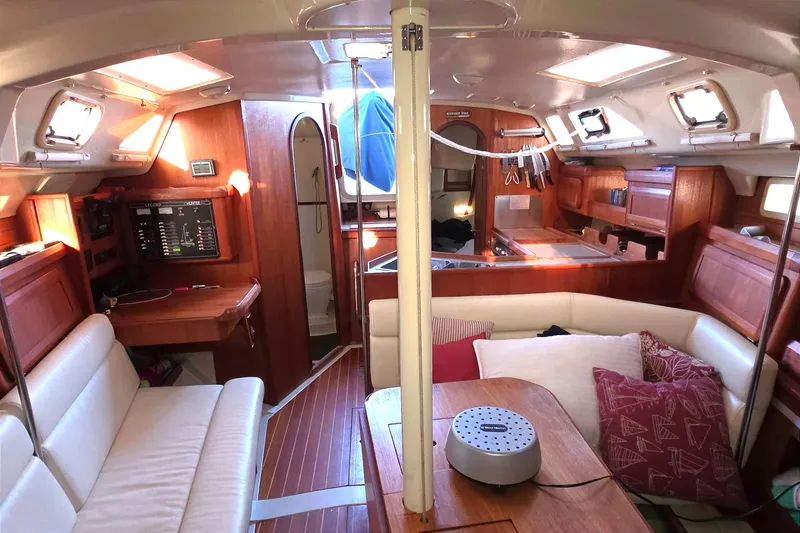 Slide: The Image of Interior of 1994 Hunter Legend 35.5 sailboat with wood finish and cozy seating area. - 7