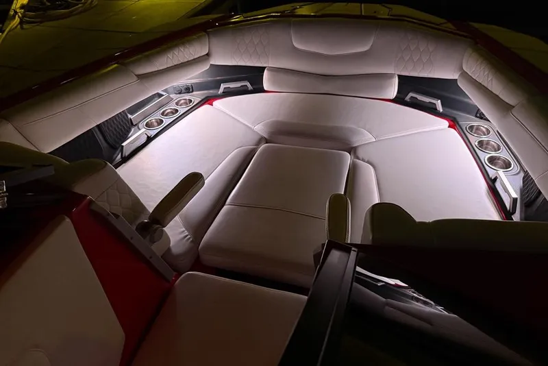 Slide: The Image of Luxurious interior of 2021 Malibu M240 boat with plush seating and cup holders. - 47